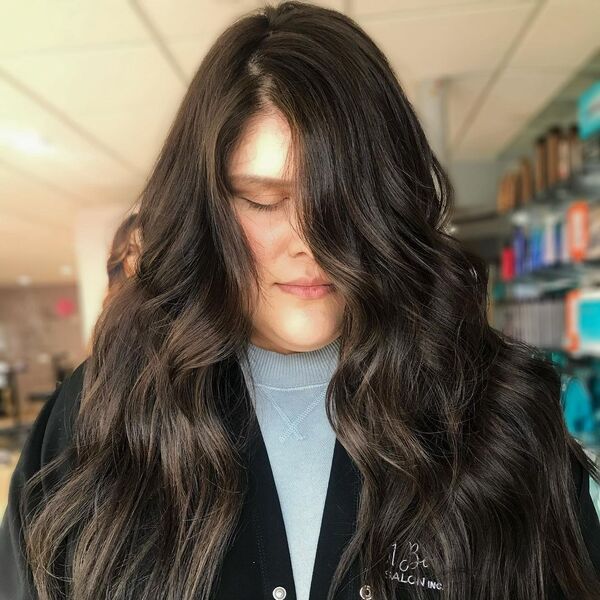 Gorgeous Brunette Balayage - a woman wearing cardigan over blue shirt.