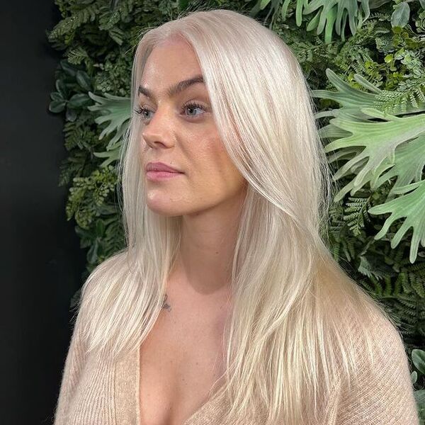 Icy White Blonde for Thin Hair - a woman wearing a brown longsleeve