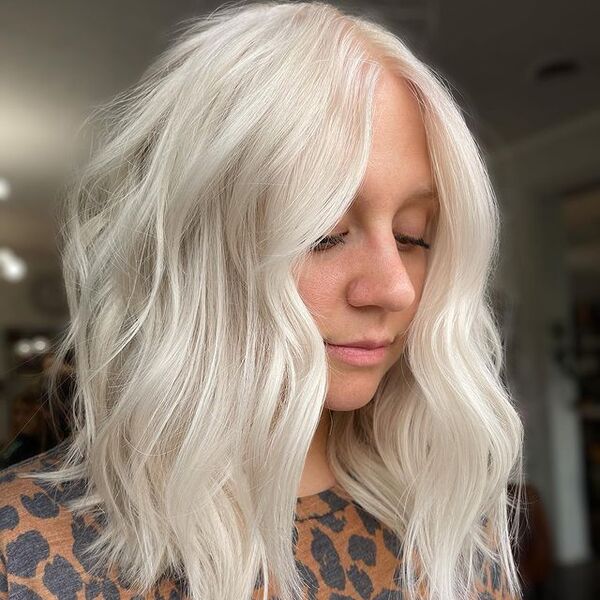 Icy White Blonde Hair - a woman wearing a tiger print shirt