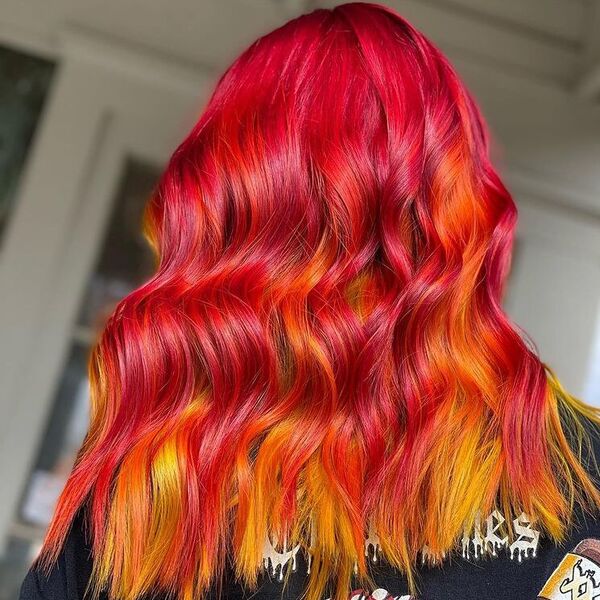 Intense Red Brown Blonde Medium Hair -a woman wearing punky shirt.