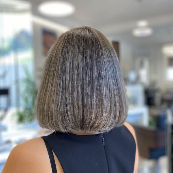 Long Bob with Ash Grey Hair - a woman wearing a halter top