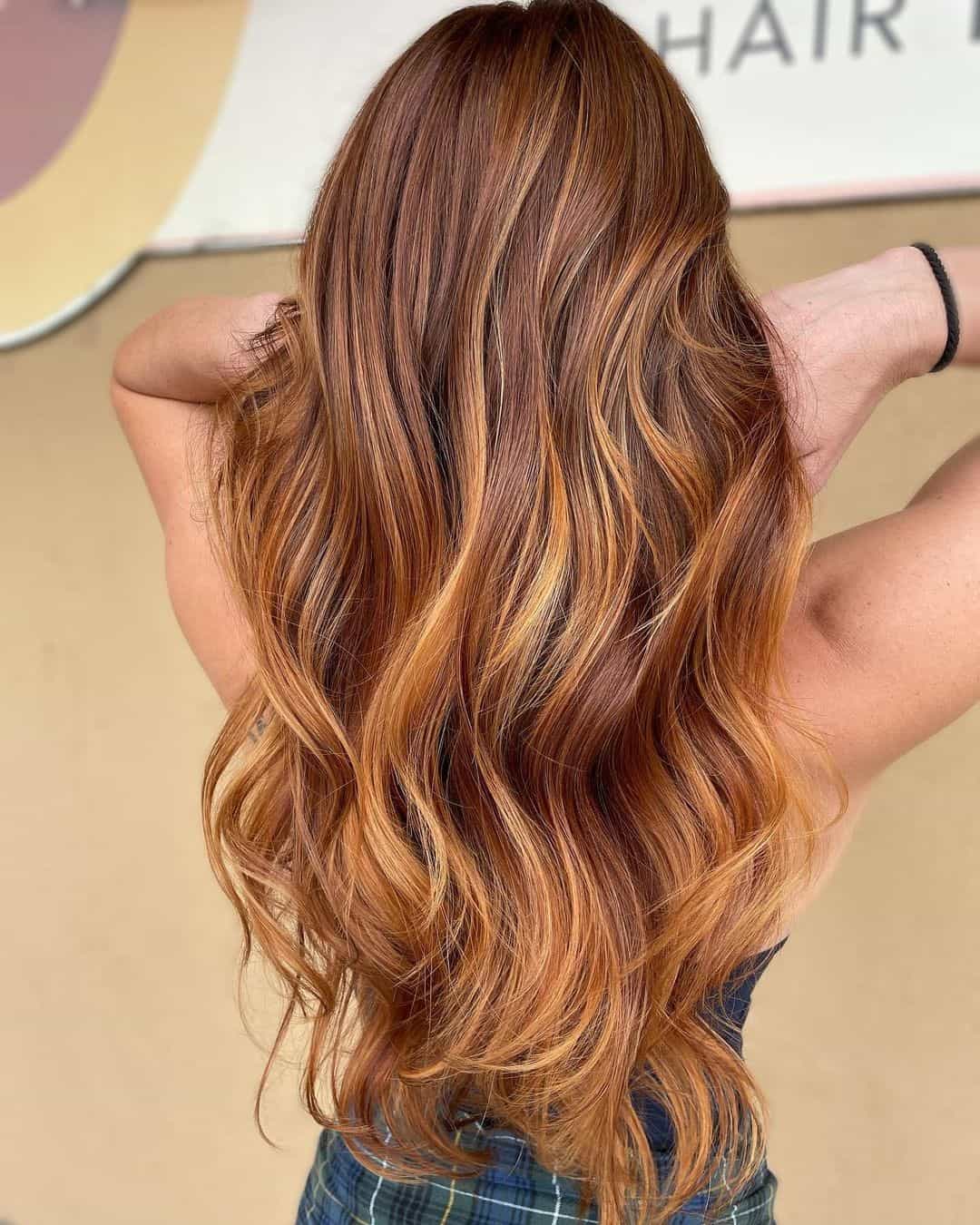 Long Light Highlights Copper Hue On Brown Hair