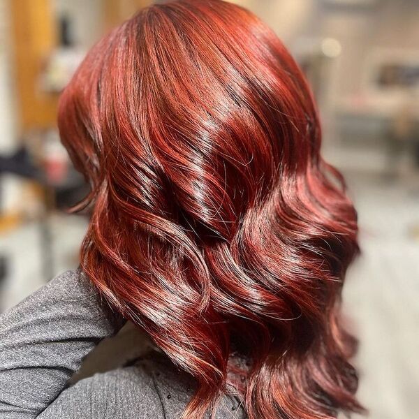 Long Mullet in Red Brown Balayage - a woman wearing dark gray long sleeves.