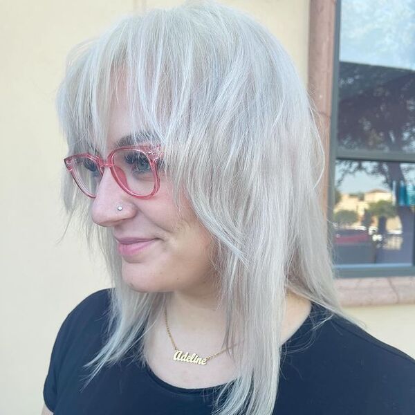 Messy White Blonde Hair - a woman wearing a a eyeglasses