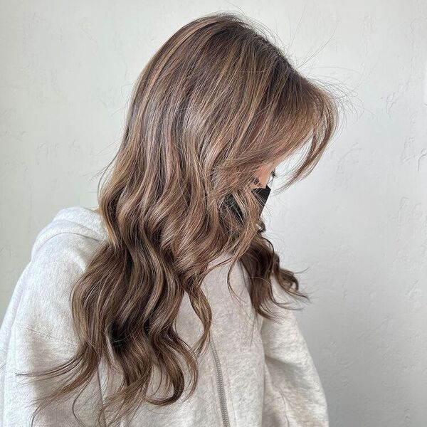 Mushroom Ashy Balayage - a woman wearing a dirty white jacket