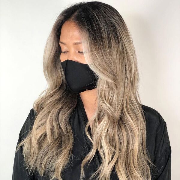 Phenomenal Ash Brown Hair - a woman wearing a black cape and a black facemask