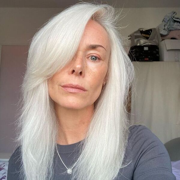 Platinum White Blonde for Older Woman - a woman wearing a gray longsleeve