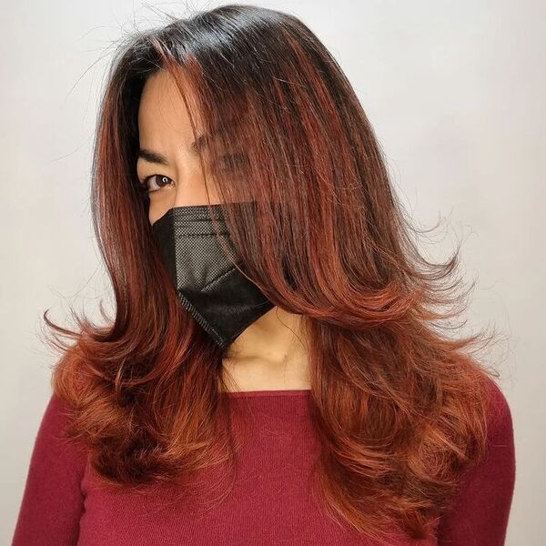 Red Brown Ombre Balayage - a woman wearing red long sleeves.