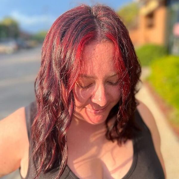 Red Highlights - a woman wearing a black sleeveless shirt