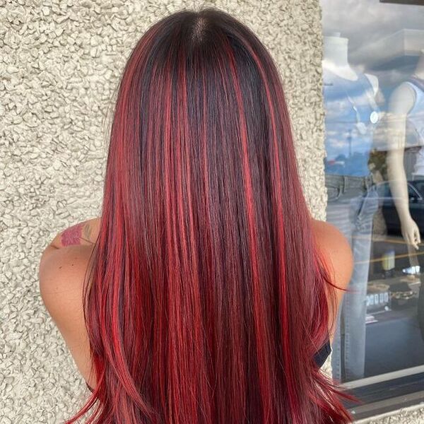 Red Highlights - a woman wearing a black top