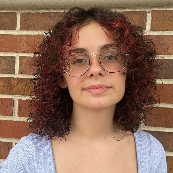 Red Highlights - a woman wearing a eyeglasses