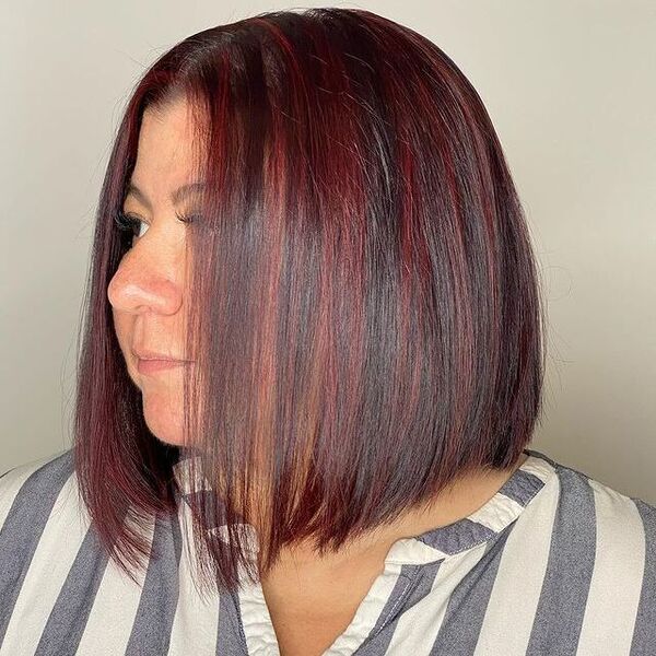 Red Highlights - a woman wearing a stripe blouse