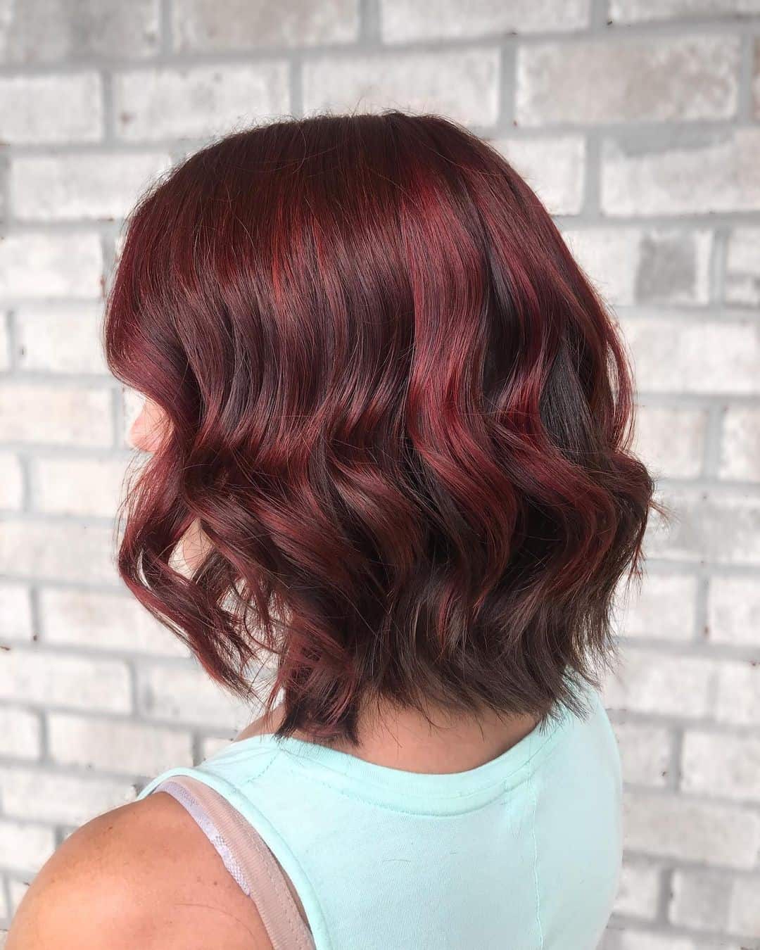 Red Highlights On Black Hair Loose Curls Short Look