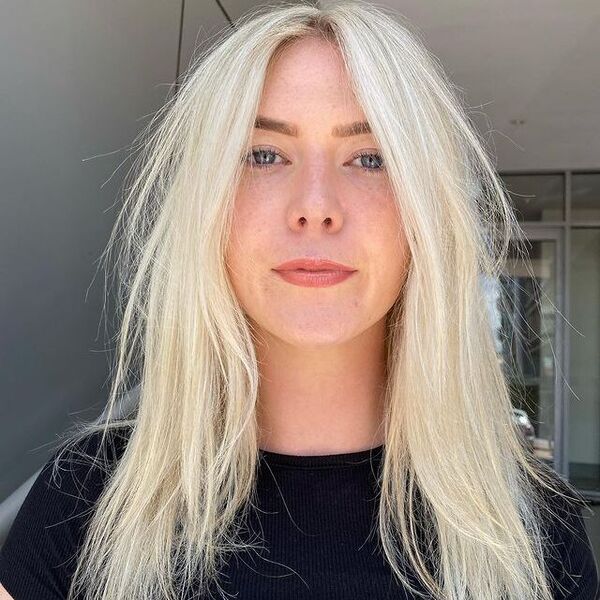 Scandi White Blonde Hair - a woman wearing a black top