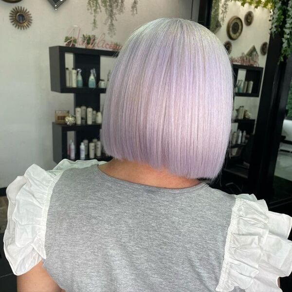 Sexy White and Silver Blonde Hair - a woman wearing a gray blouse