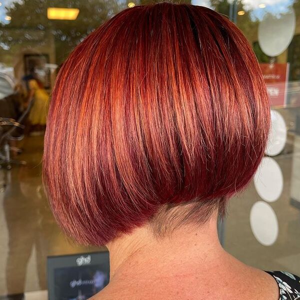 Shaved Nape Bob in Red Brown - a woman wearing floral top.