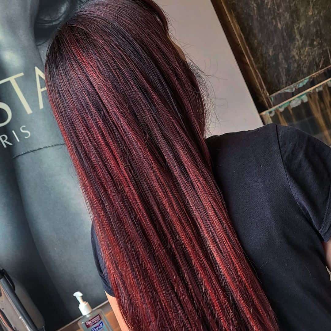 Sleek Shiny Red Highlights On Black Hair