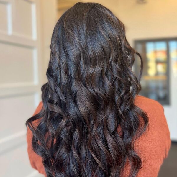 Spiced Up Dark Tone Hair with Balayage - a woman wearing rustic top.