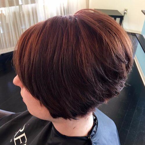 stacked bob haircut on burgundy hair