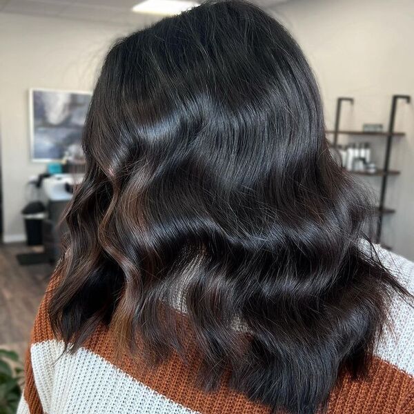 Subtle Balayage on Dark Hair - a woman wearing two tone crochet sweater.