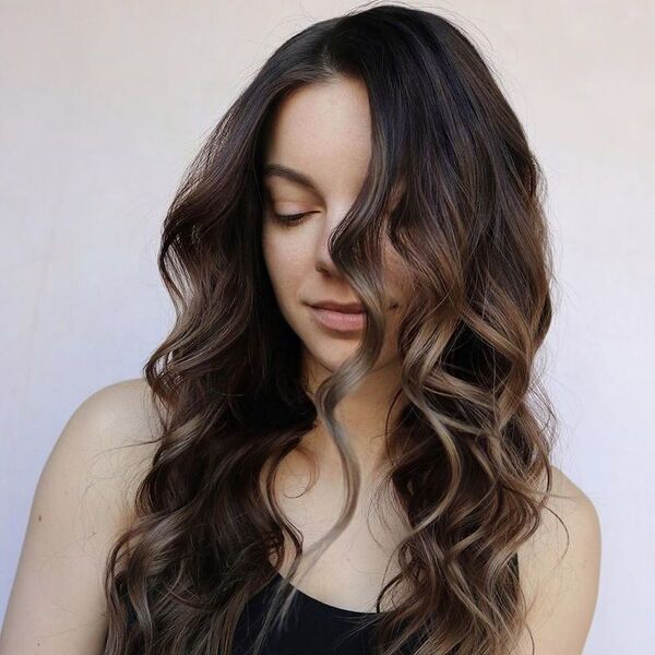 Textured Curled Balayage - a woman wearing black tank top.