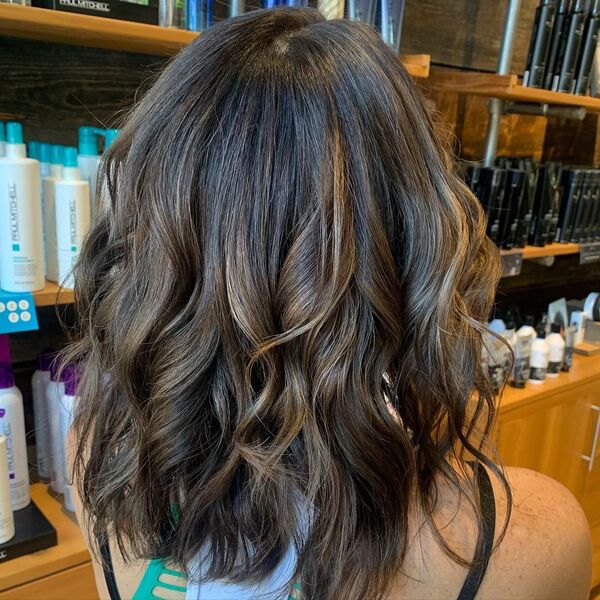 Wavy Short Ash Brown Hair - a woman wearing a sleeveless top