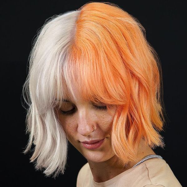 White and Orange Split Blonde Hair - a woman wearing a brown shirt