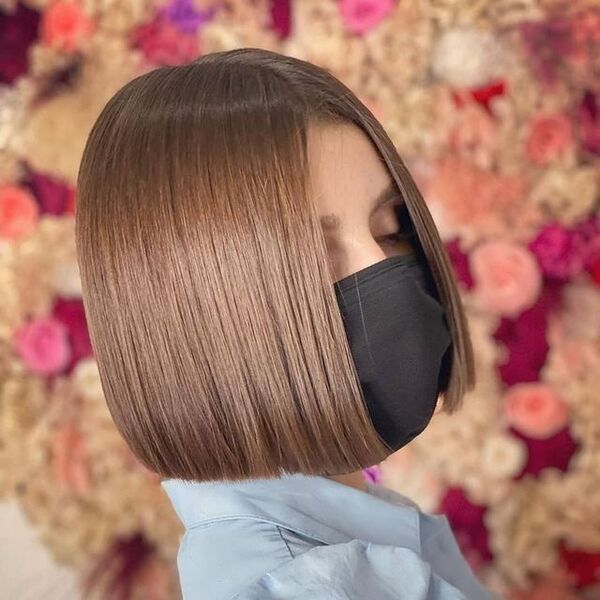 a girl wearing black mask
