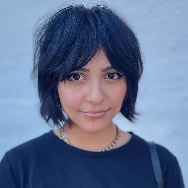 A woman wearing a black shirt