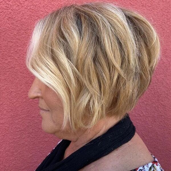 a woman wearing a floral blouse with angle bob haircut