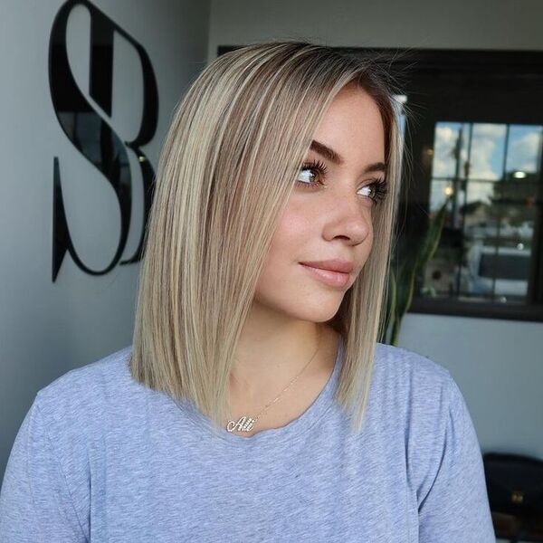 a woman wearing a gray shirt