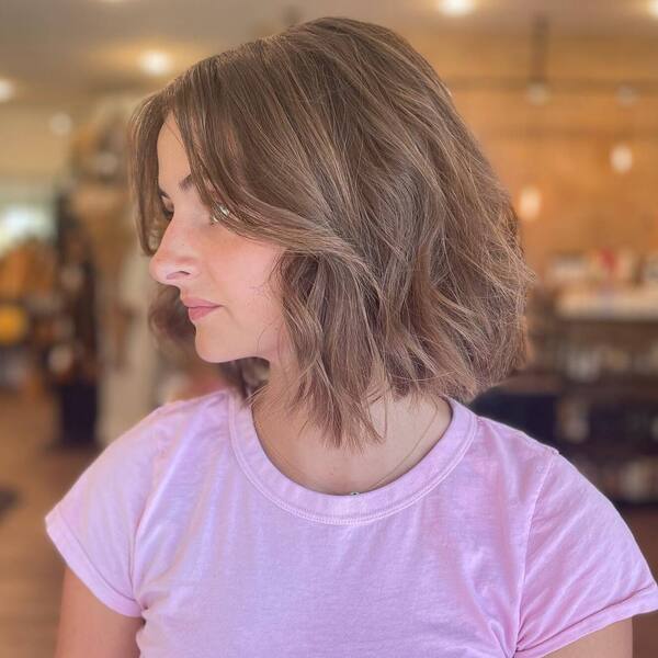 a woman wearing a purple shirt