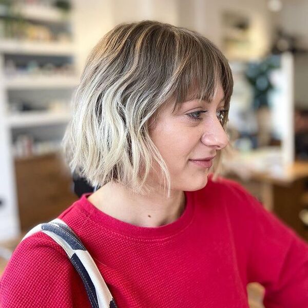 A woman wearing a red longsleeve