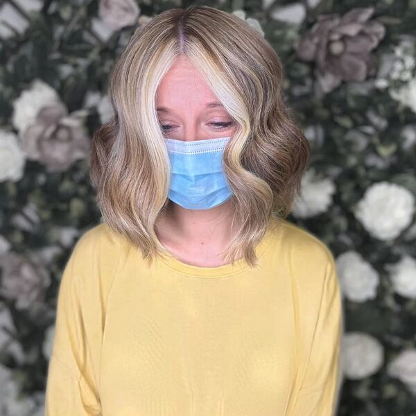 a woman wearing a surgical facemask