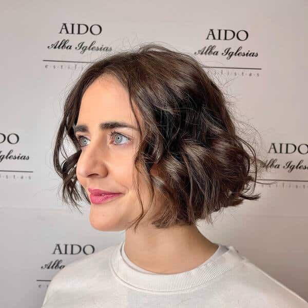 A woman wearing a white shirt