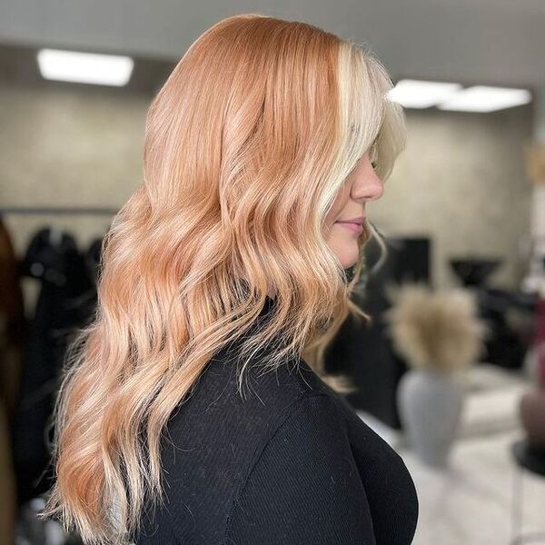 Beautiful Peachy Hair with Face Framing - a woman wearing a black longsleeve