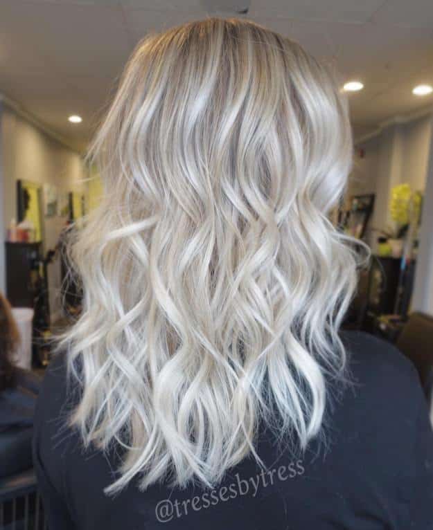 Blonde Curly Hair with Darkened Roots