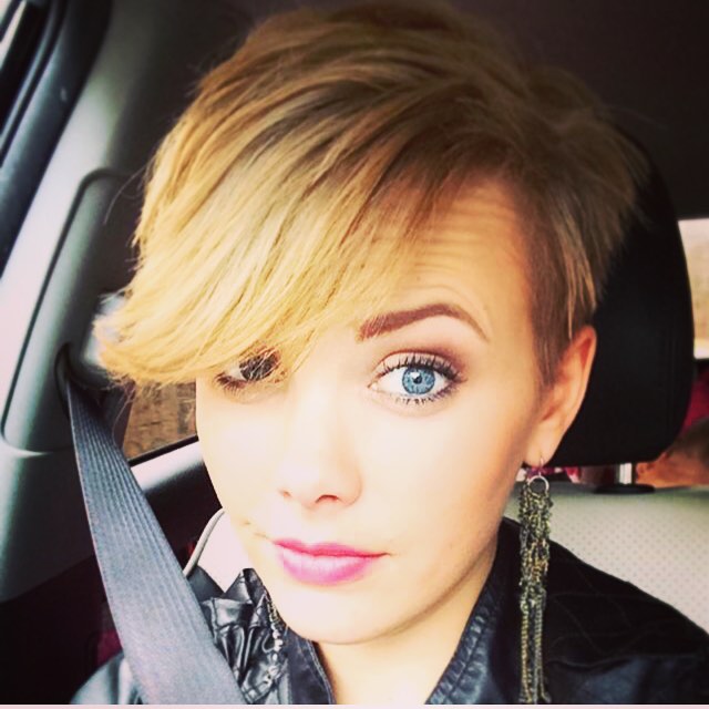 blonde pixie cut with long bangs