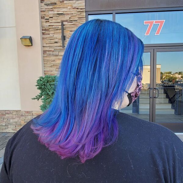 blue and purple hairstyle - a woman wearing a black shirt