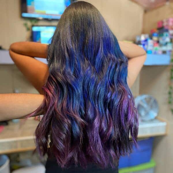 blue and purple hairstyle - a woman wearing a black sleeveless shirt