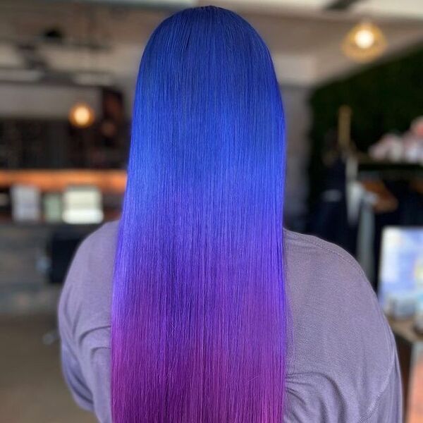 blue and purple hairstyle - a woman wearing a gray longsleeve