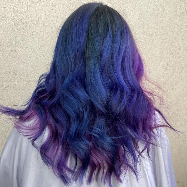 blue and purple hairstyle - a woman wearing a white cape