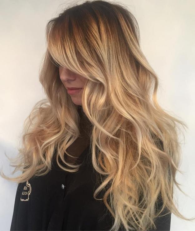 Caramel Blonde Layered Hair With Side Bangs