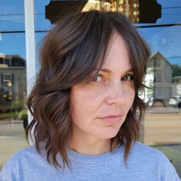 Choppy bob - a woman wearing a gray shirt