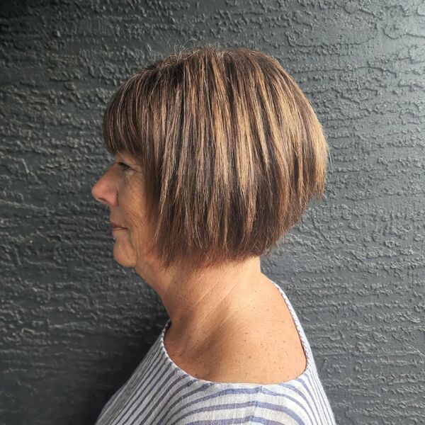 Choppy bob - a woman wearing a striped blouse