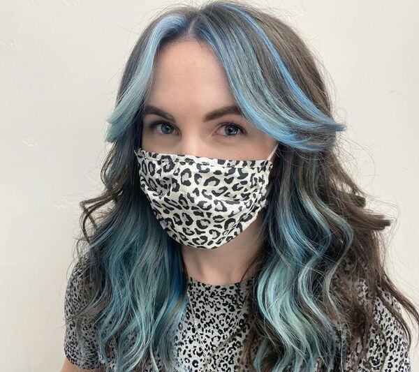 Face-Framing Icy Light Blue Hair - a woman wearing a printed facemask