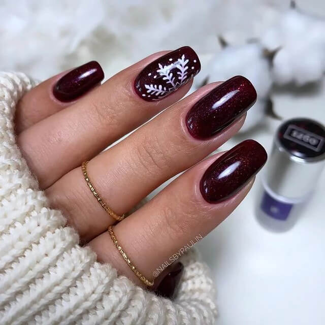 Glimmering And Trendy Burgundy Color Nails With Snowflakes
