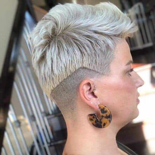 Irregular Shave Undercut Edgy Pixie - a woman wearing loop long earrings