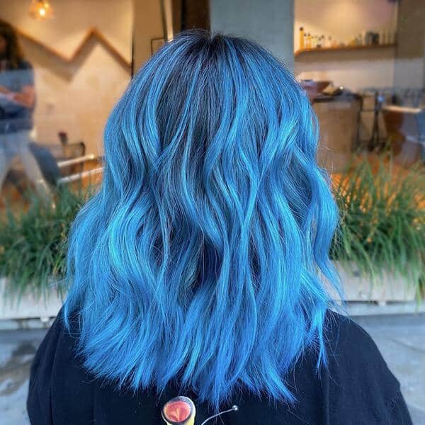 Light Blue on Dark Hair - a woman wearing a black shirt