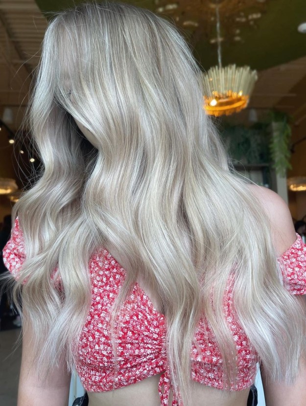 Long Blonde Hairstyle with Subtle Waves for Fair Skin